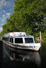 Wakenitzschiff in Naturbild Wasser Flusslandschaft Amazonas Norddeutschlands